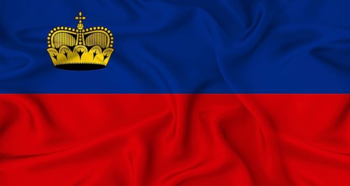 Realistic Liechtenstein flag waving. Close up of flag of Liechtenstein with cloth texture