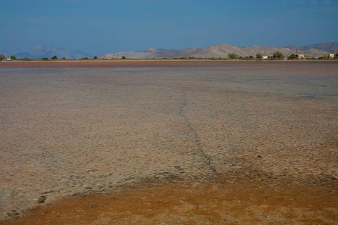 Dry landscape with far horizon and distant mountains, salt lake, Tigaki, nature reserve, hydro