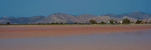 Vast landscape with mountains and huts by the lake, clear sky offered, salt lake, Tigaki, nature