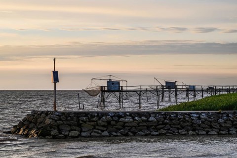 Sunset over Fishing huts over Randonnee entre Histoire et Nature, Fouras, Fouras-les-Bains,