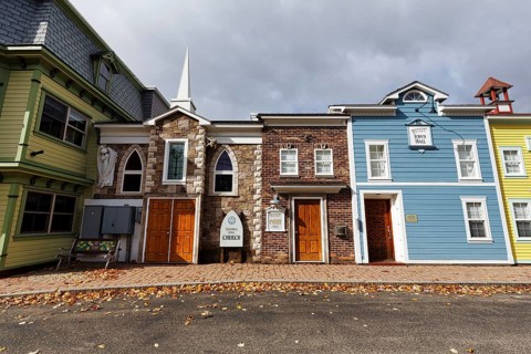 Replica, historic town hall, post office, church, colorful facades, signs with inscription, fall