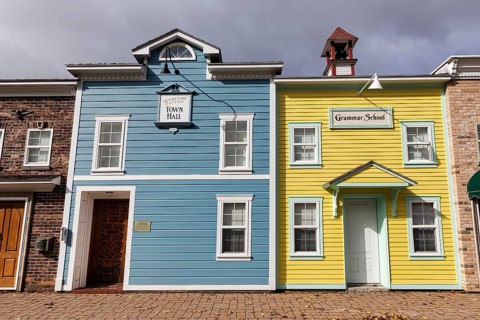 Replica, historic town hall, historic elementary school, colorful facades, signs with inscription,