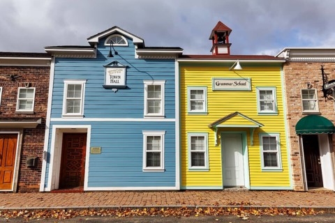 Replica, historic town hall, historic elementary school, colorful facades, signs with inscription,