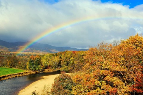 Scenic river landscape with rainbow, Saco River in Mount Washington Valley, fall leaves, Indian