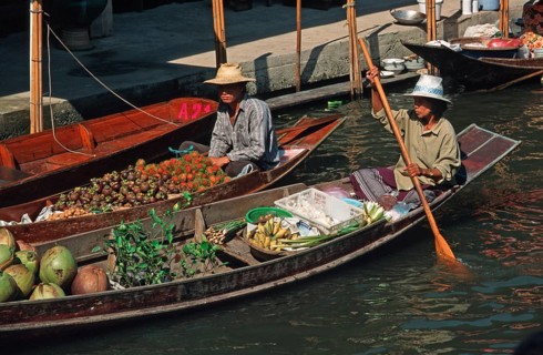 Merchants in their boats at Damnoen Saduak Floating Market, Thailand, December 2002, vintage,