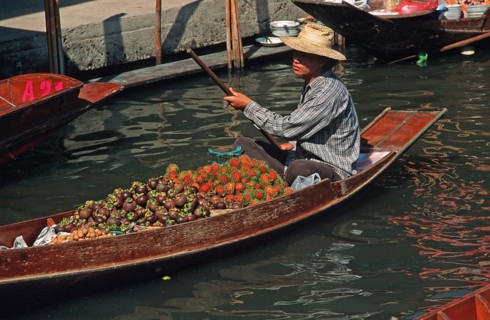 Merchant in his boat at Damnoen Saduak Floating Market, Thailand, December 2002, vintage, retro,