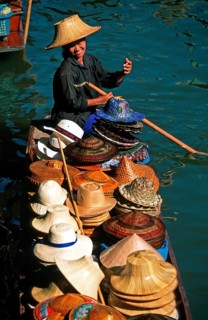 Hat seller in her boat at Damnoen Saduak Floating Market, Thailand, December 2002, vintage, retro,