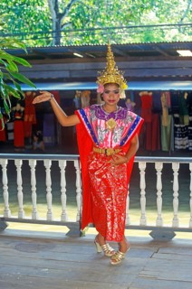 Young person wearing Thai drama clothes at Damnoen Saduak Floating Market, Thailand, December 2002,