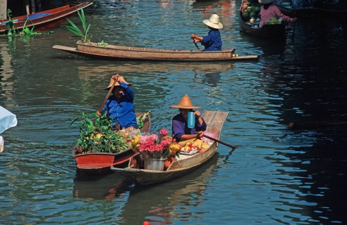 Merchants in their boats at Damnoen Saduak Floating Market, Thailand, December 2002, vintage,