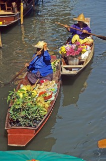 Merchants in their boats at Damnoen Saduak Floating Market, Thailand, December 2002, vintage,