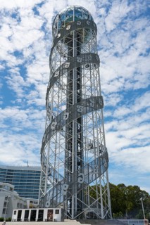 Towering tower with spiral steel structure against a cloudy sky, Alphabetic Tower, Georgian