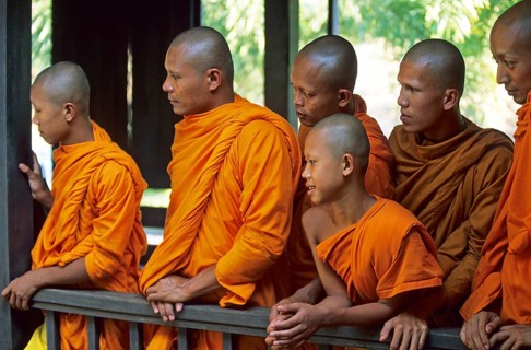 Monks watch performance, Samphran Elephant Ground and Zoo near Bangkok, Thailand, December 2002,