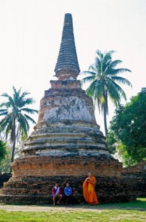 People, monk, boys, palm trees, chedi at Wat Phra Si Sanphet, Ayutthaya, Thailand, December 2002,