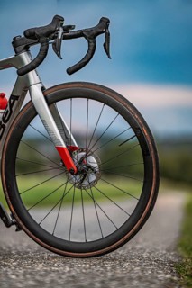 Close-up of a bicycle tire on a country road with cloudy sky, triathlon, Calw, Germany