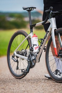 Close-up view of a bicycle with water bottle and sprocket in natural surroundings, triathlon, Calw,