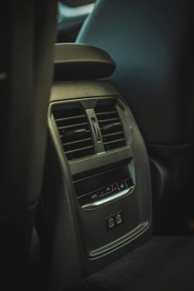 Ventilation grille in the interior of a car in dark colors, BMW i7 electric car, Deer e-Carsharing,