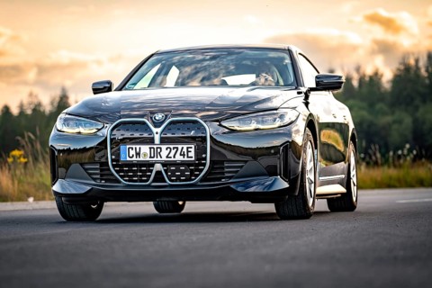 BMW on open road with background in evening light, BMW i7 electric car, Deer e-Carsharing, Calw,