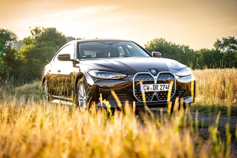 BMW in the field at sunset with natural backdrop, BMW i7 electric car, Deer e-Carsharing, Calw,