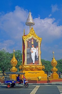 Tuk-tuk, portrait of King Bhumipol at a crossroads in Bangkok, Thailand, December 2002, vintage,