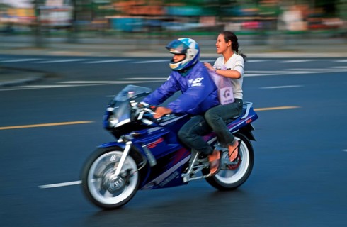 Man and woman on motorcycle, motion-blurred, Bangkok, Thailand, December 2002, vintage, retro, old,