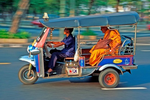 Monk in a three-wheeled tuk tuk taxi, blurred, Bangkok, Thailand, December 2002, vintage, retro,