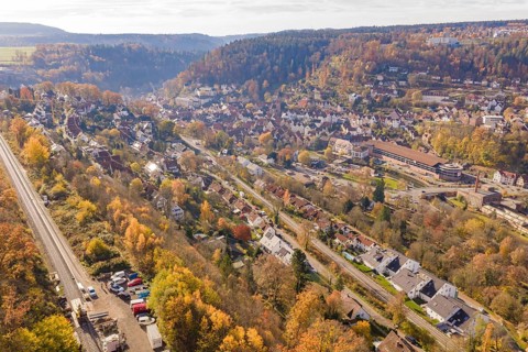 City landscape with autumn colors and railroad tracks from a bird's eye view, Calw, Black Forest,