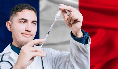 Doctor holding syringe on France flag background. Medical professional holding syringe with French
