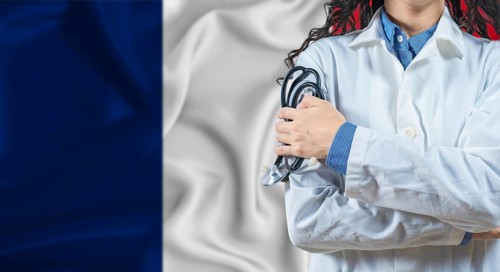 Healthcare professional with France flag background. Professional doctor holding stethoscope on