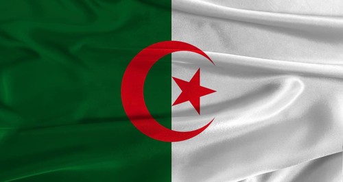 Flag of Algeria with fabric textured background. Close up of National flag of Algeria with