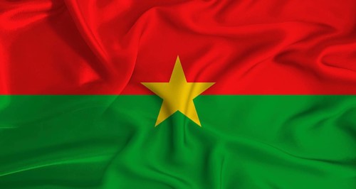 Realistic Burkina Faso flag waving. Close up of flag of Burkina Faso with cloth texture