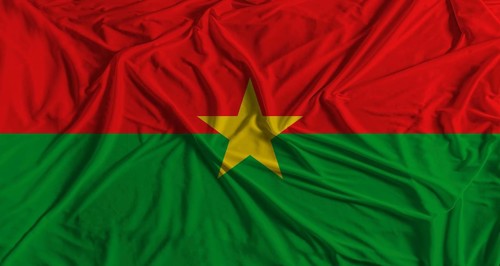 Burkina Faso flag with fabric texture background. National flag of Burkina Faso with cloth texture