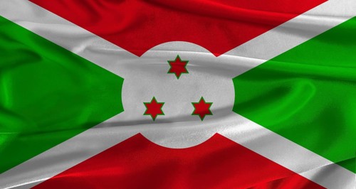 Flag of Burundi with fabric textured background. Close up of National flag of Burundi with