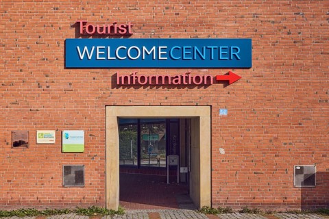 Welcome Center, tourist information, façade, brick, passage arch, sunny, Kiel, state capital,