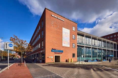 New town hall, brick building, brick architecture, modern architecture, façade with windows, trees,