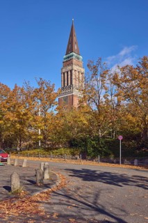 Town Hall Tower, sidewalk, barrier bollard, road, curve, traffic sign absolute stopping, trees,