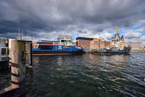 Kiel Fjord, harbour, wharf, dock, duckdalben, passenger ship Düsternbrook, harbour tug and sea tug