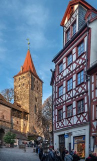 Medieval Tiergärtnertorturm, on the right a historic half-timbered residential building,