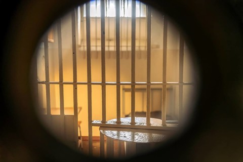 View through a keyhole into a cell in the former Stasi prison Bautzen II, now a memorial in