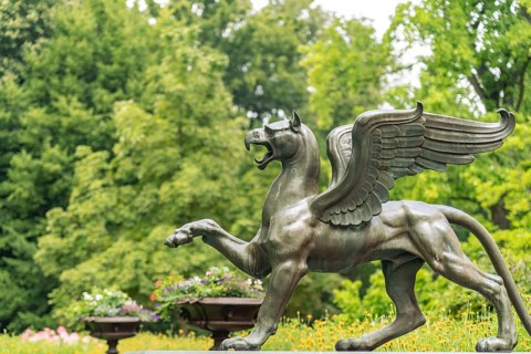 Bronze griffin sculpture in Branitz Park in front of Branitz Castle, landscape park created in 1846