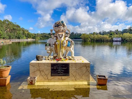 Three-headed sculpture Statue of Dattatreya embodiment of triform Trimurti combines characteristics