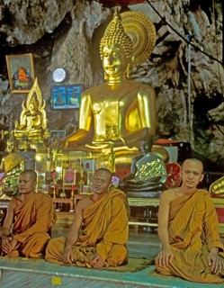 Buddha statue, monks praying, Wat Tam Sua monastery near Krabi, Thailand, December 2002, vintage,