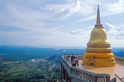 View, people, chedi in the monastery of Wat Tam Sua, which is partly on the top of a mountain,
