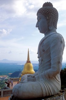 Buddha statue and chedi in Wat Tam Sua monastery, which is partly on the top of a mountain, Krabi,