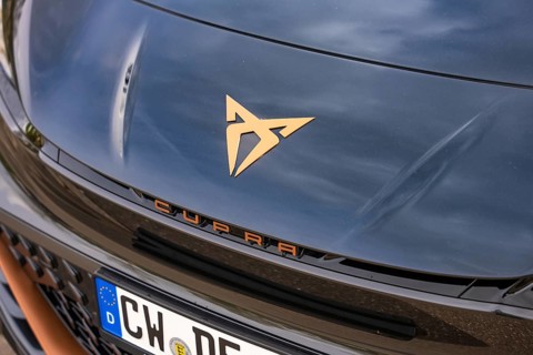 Close-up of a shiny car emblem on a dark hood, electric car Cupra, e-car sharing, Calw, Germany