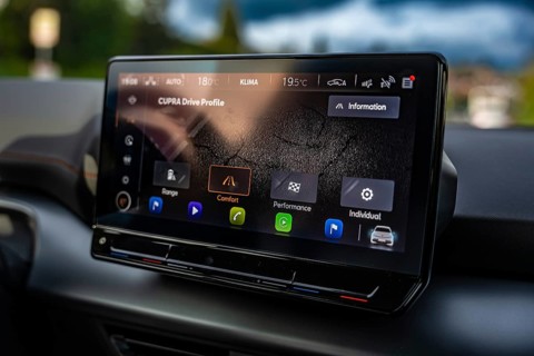 Modern infotainment display in a Cupra vehicle with various driving profiles and navigation