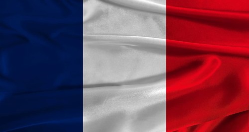 Flag of France with fabric textured background. Close up of National flag of France with realistic