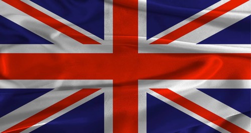 Flag of the United Kingdom with fabric textured background. Close up of National flag of the United