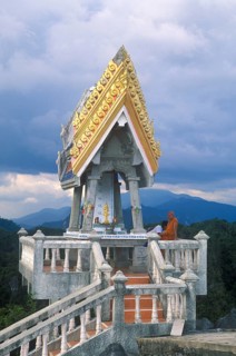Monk in the monastery of Wat Tam Sua, which is partly on the summit of a mountain, near Krabi,
