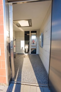 Modern bathroom with tiled floor and wall mirror, Weil der Stadt railway station, Germany
