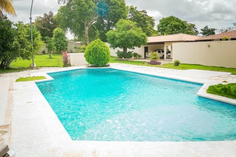 Beautiful crystal clear home pool. A crystal clear home swimming pool on a sunny day, Concept of